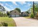 Spacious two-car garage with a long driveway, perfect for extra parking and easy access at 421 Tranquil Bay Cir, Norwood, NC 28128