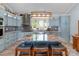 Stylish kitchen with an island, modern stainless appliances, and unique backsplash at 421 Tranquil Bay Cir, Norwood, NC 28128