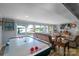 Relaxing living room with lake views, comfortable seating, and air hockey table at 421 Tranquil Bay Cir, Norwood, NC 28128