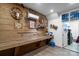 Wood paneled storage room with built-in bench and shelves, decorated with rustic accents at 421 Tranquil Bay Cir, Norwood, NC 28128