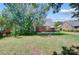 Backyard featuring a brick home, patio, and well-maintained lawn at 4302 Ethel Sustar Dr, Monroe, NC 28110