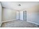 This neutral bedroom offers plush carpet and an open doorway to another room at 4302 Ethel Sustar Dr, Monroe, NC 28110