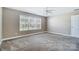 Spacious bedroom features neutral paint, plush carpeting, and a ceiling fan at 4302 Ethel Sustar Dr, Monroe, NC 28110