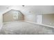 This neutral bedroom offers a window and plush carpet at 4302 Ethel Sustar Dr, Monroe, NC 28110