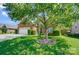 Charming home featuring lush front lawn, mature shade trees, and a brick facade, all under a bright blue sky at 4302 Ethel Sustar Dr, Monroe, NC 28110