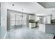 Spacious living and dining area with white cabinets, stainless appliances, and a breakfast nook at 4302 Ethel Sustar Dr, Monroe, NC 28110
