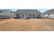 Backyard featuring a patio area with outdoor furniture, a grill, and a black fence at 4318 Greenleaf Nw St, Concord, NC 28027