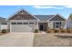 Charming one-story home with a well-manicured lawn and attached two-car garage at 4318 Greenleaf Nw St, Concord, NC 28027