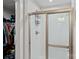 Bright bathroom featuring a shower with white tiled walls and a glass door at 4318 Greenleaf Nw St, Concord, NC 28027