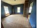 A bedroom with two windows that provide natural light into the space and an incomplete closet area at 4349 Roberta Rd, Concord, NC 28027