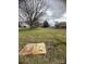 A large empty lot with grass and bare trees on an overcast day presents a great space for building a home at 4349 Roberta Rd, Concord, NC 28027