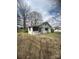One-story home with shade awnings, plus a large yard and mature trees at 4349 Roberta Rd, Concord, NC 28027
