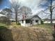 Quaint home featuring a chimney, shaded windows, and a large yard at 4349 Roberta Rd, Concord, NC 28027
