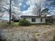 Home's rear view, showing the storage building and large yard at 4349 Roberta Rd, Concord, NC 28027