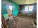 A room needing repair and renovation features unfinished walls and damaged floors at 4349 Roberta Rd, Concord, NC 28027