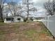 Large yard view with fencing and mature trees near the home at 4349 Roberta Rd, Concord, NC 28027