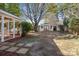 Spacious backyard with a shed, partial patio cover and mature trees at 4515 Country Meadows Dr, Gastonia, NC 28056