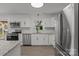 Modern kitchen featuring stainless steel appliances, granite countertops and white cabinets at 4515 Country Meadows Dr, Gastonia, NC 28056