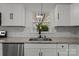 Modern kitchen features stainless steel appliances, white cabinets and stone countertops at 4515 Country Meadows Dr, Gastonia, NC 28056
