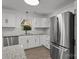 Bright kitchen with stainless steel appliances, white cabinets and stone countertops at 4515 Country Meadows Dr, Gastonia, NC 28056