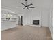 Living space open to kitchen with neutral paint and fireplace at 4515 Country Meadows Dr, Gastonia, NC 28056