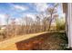 The backyard has trees and is situated on a sloping hill at 4852 Stone Dr, Conover, NC 28613