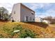 View of the grassy, sloping backyard from the house's back patio at 4852 Stone Dr, Conover, NC 28613