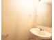 Powder room with a pedestal sink, neutral paint, and a framed mirror over the sink at 4852 Stone Dr, Conover, NC 28613