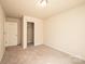 The bedroom has neutral walls and carpet and a closet for storage at 4852 Stone Dr, Conover, NC 28613