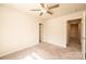 A basic bedroom with neutral carpet and paint provides a blank slate for new owners at 4852 Stone Dr, Conover, NC 28613