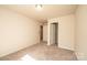 The bedroom has neutral walls and carpet and a closet for storage at 4852 Stone Dr, Conover, NC 28613