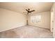 Cozy bedroom featuring carpet, a ceiling fan, and double windows for natural light at 4852 Stone Dr, Conover, NC 28613