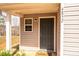 Close up of the home's front door and small, adjacent window at 4852 Stone Dr, Conover, NC 28613