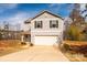 Inviting two-story home boasts a well-maintained lawn and an attached two-car garage at 4852 Stone Dr, Conover, NC 28613
