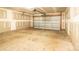 Spacious two-car garage featuring concrete floors and an automatic door opener for added convenience at 4852 Stone Dr, Conover, NC 28613
