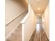 The upstairs hallway features neutral paint and trim, hard surface flooring, and carpeted stairs at 4852 Stone Dr, Conover, NC 28613