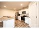 Modern kitchen features stainless steel appliances, granite counters and ample cabinet space at 4852 Stone Dr, Conover, NC 28613