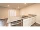 Granite counter tops extend to a bar top in this open concept kitchen and living area at 4852 Stone Dr, Conover, NC 28613