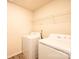 Laundry area with washer, dryer, and wire shelving at 4852 Stone Dr, Conover, NC 28613