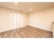 Bright living room featuring wood-look floors and natural light from a window at 4852 Stone Dr, Conover, NC 28613