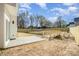 Expansive backyard showcasing a wooden bridge, patio, and new wood fence at 5108 Potter Rd, Matthews, NC 28104