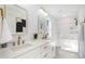 Beautiful bathroom with double vanities, modern fixtures, and a separate shower stall at 5108 Potter Rd, Matthews, NC 28104