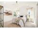 Cozy bedroom with a ceiling fan, neutral color palette, and plenty of natural light at 5108 Potter Rd, Matthews, NC 28104