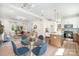 Open-concept kitchen and dining area with stylish furniture and modern lighting at 5108 Potter Rd, Matthews, NC 28104