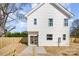 A two-story home featuring a sliding glass door and a fenced-in yard at 5108 Potter Rd, Matthews, NC 28104
