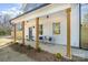 A welcoming front porch with wooden columns and a seating area at 5108 Potter Rd, Matthews, NC 28104