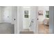 Hallway leading to bedroom, featuring white walls and carpeted floors at 5108 Potter Rd, Matthews, NC 28104