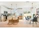 Modern kitchen with stainless steel appliances, an island with bar seating, and a dining area at 5108 Potter Rd, Matthews, NC 28104