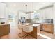 Bright kitchen featuring stainless steel appliances, island seating, and modern fixtures at 5108 Potter Rd, Matthews, NC 28104