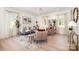 Bright and airy living room with modern decor, stylish furniture, and large windows at 5108 Potter Rd, Matthews, NC 28104